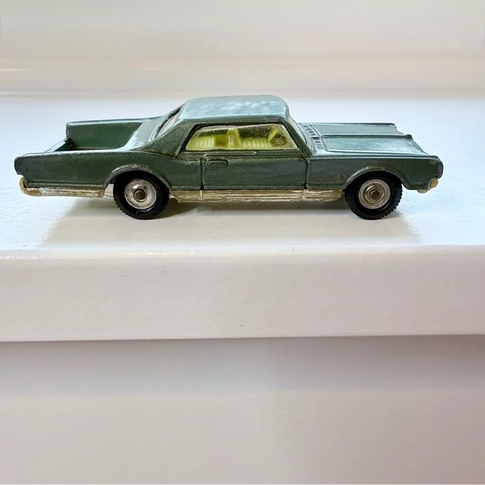 Vintage Husky Oldsmobile Starfire Coupe die-cast toy car rare green